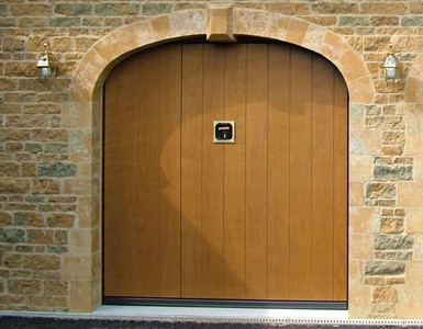 Silvelox Timber Up and Over Garage Door with inset Pedestrian Door